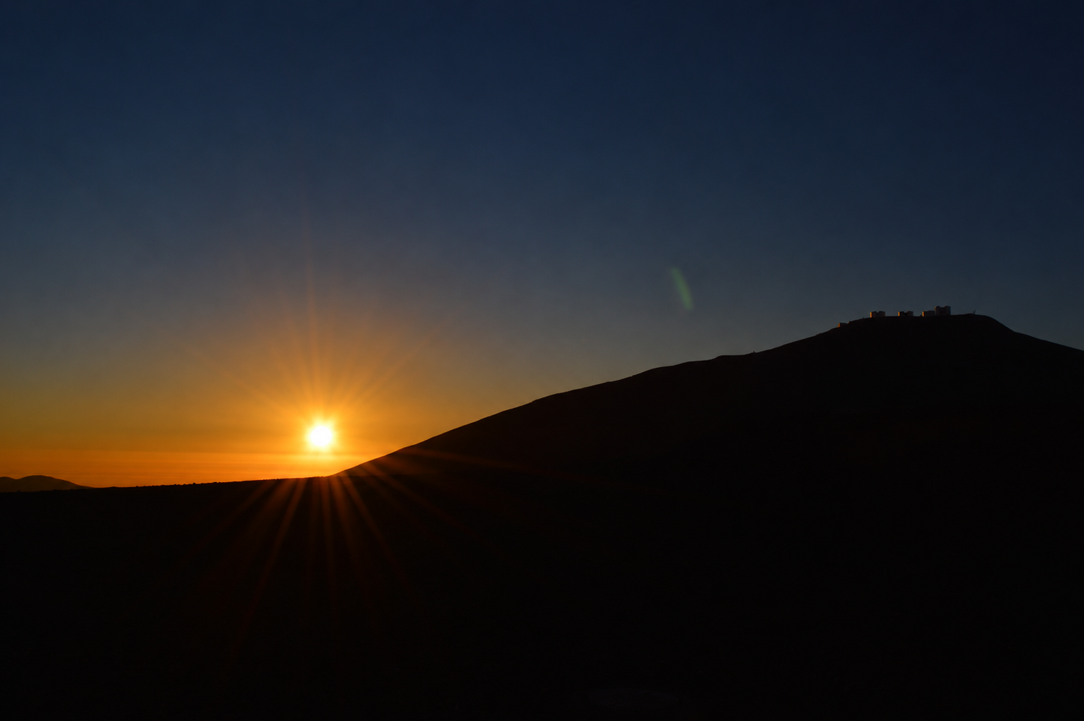Sunset over an observatory ridge in Chile